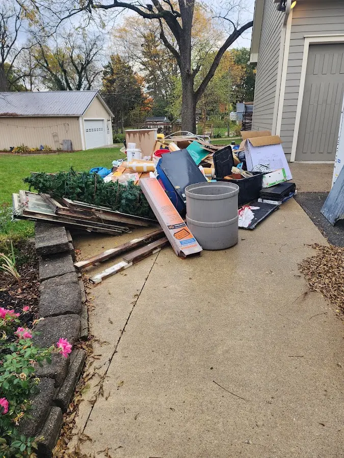 Dumpster being loaded with debris for Commercial Dumpster Rental in Winchester